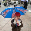 luka holding spiderman umbrella